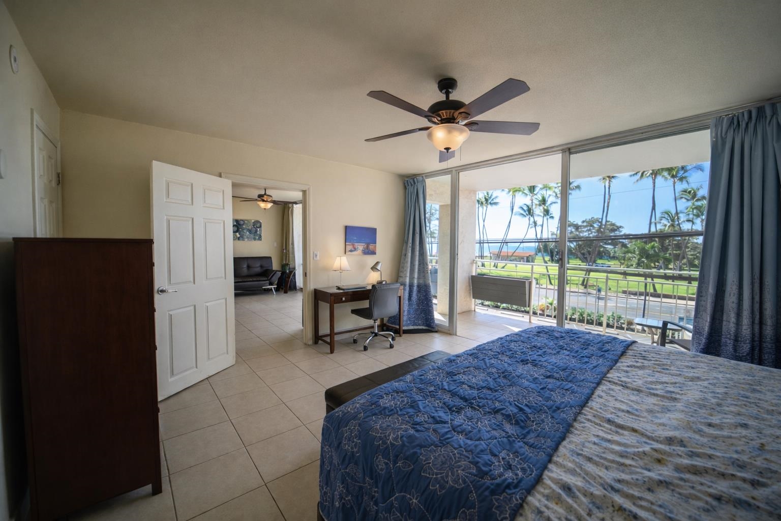 1993 South Kihei Road, Unit 201 Kihei, HI 96753 - Photo 6 of 11 a living room with a bed furniture and a large window
