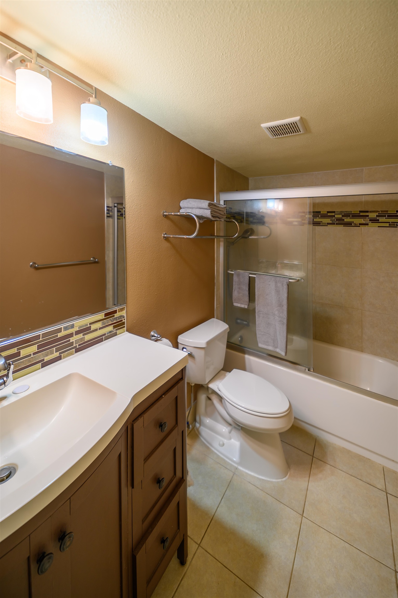 1993 South Kihei Road, Unit 201 Kihei, HI 96753 - Photo 9 of 11 a bathroom with a granite countertop sink toilet and shower