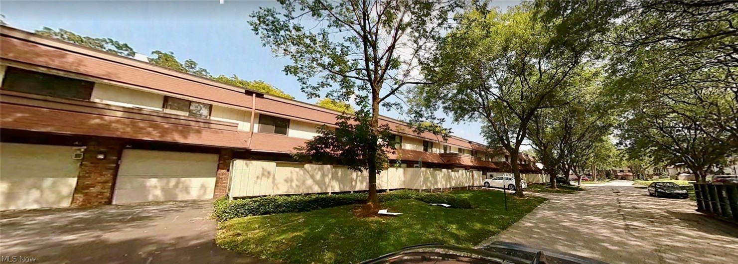 9956 Johnnycake Ridge Road East, Unit A8 Painesville, OH 44077 - Photo 27 of 29 View of property featuring a garage