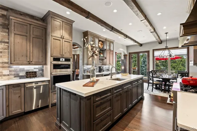 a kitchen with a sink stove and cabinets