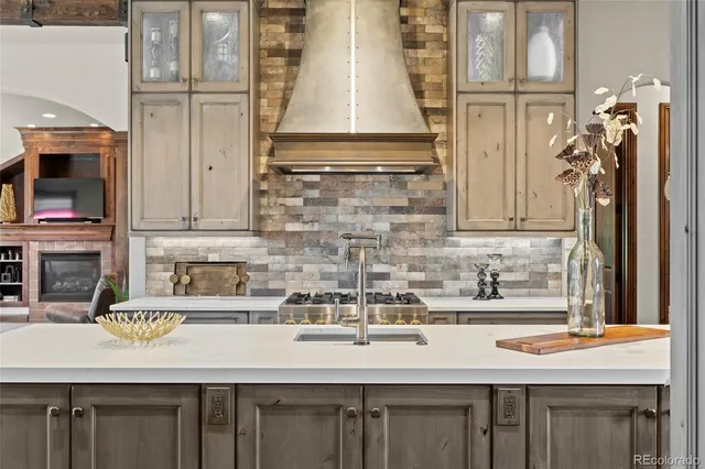 a kitchen with a sink and a refrigerator