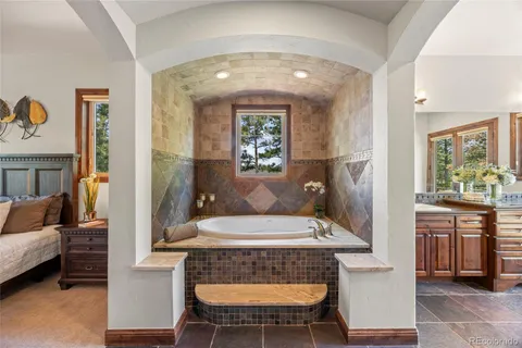 a view of hall way with furniture and window