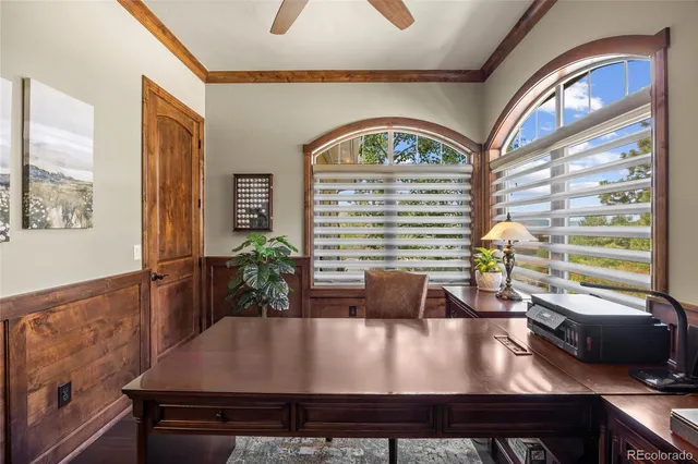 a bathroom with a granite countertop toilet and a sink