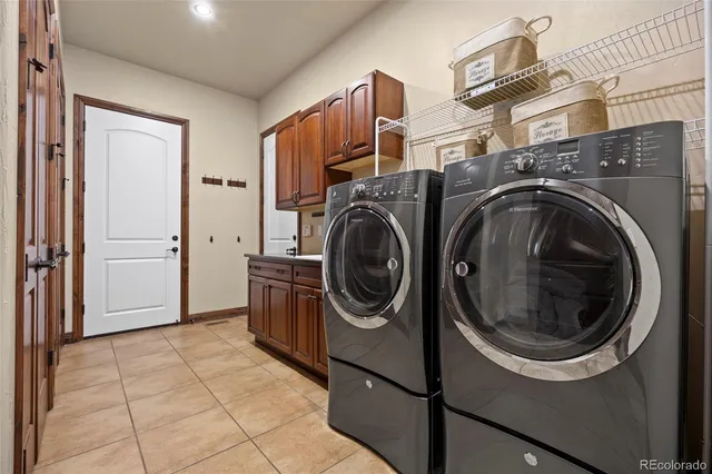 a view of a balcony with furniture and floor to ceiling window