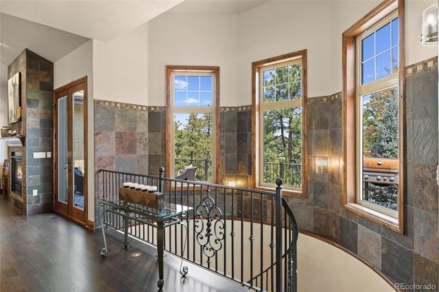a living room with furniture and stairs