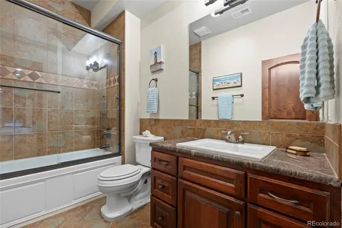 a view of a livingroom with workspace and a window