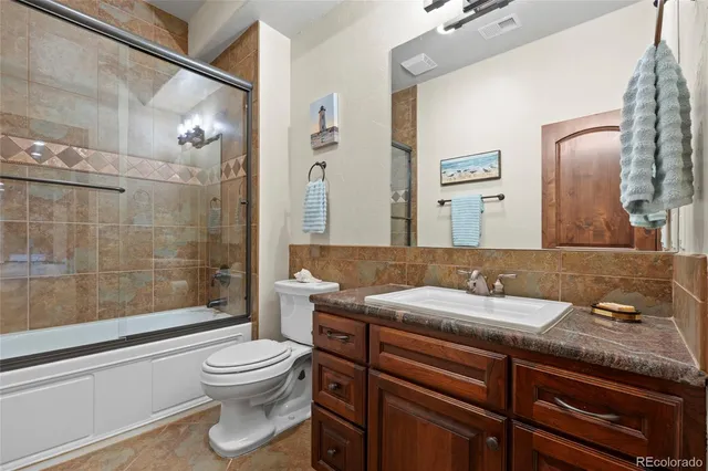 a view of a livingroom with workspace and a window