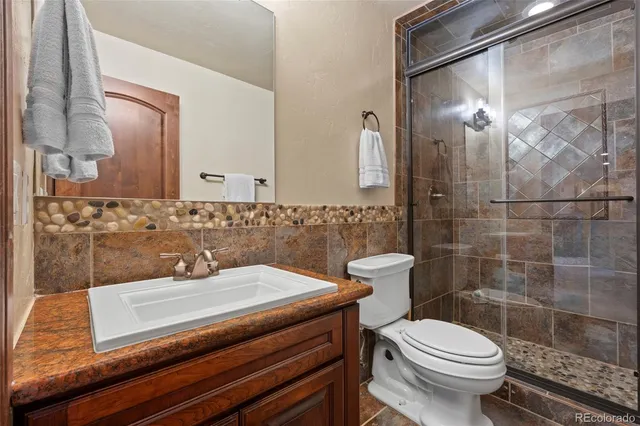 an aerial view of houses with yard