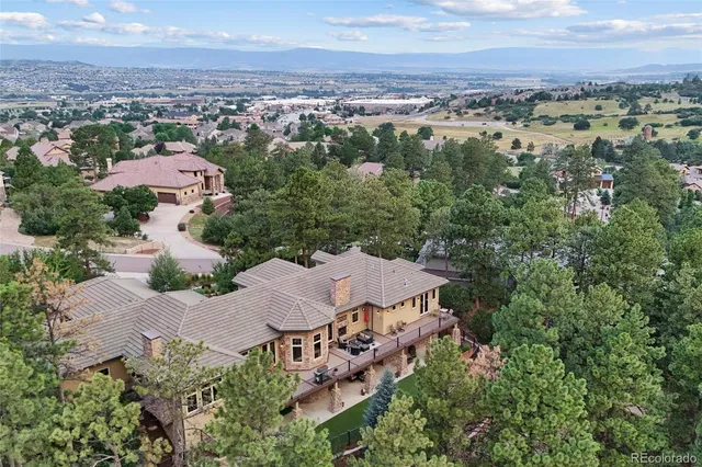 a picture of a kitchen with refrigerator and sink