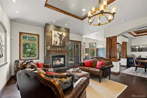 a living room with furniture fireplace and window