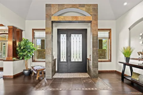 a view of livingroom with hardwood floor and bench