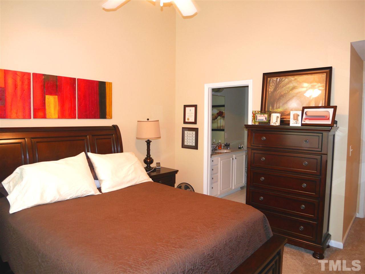 4827 Black Mountain Path Raleigh, NC 27612 - Photo 11 of 19 a bedroom with a bed and a dresser