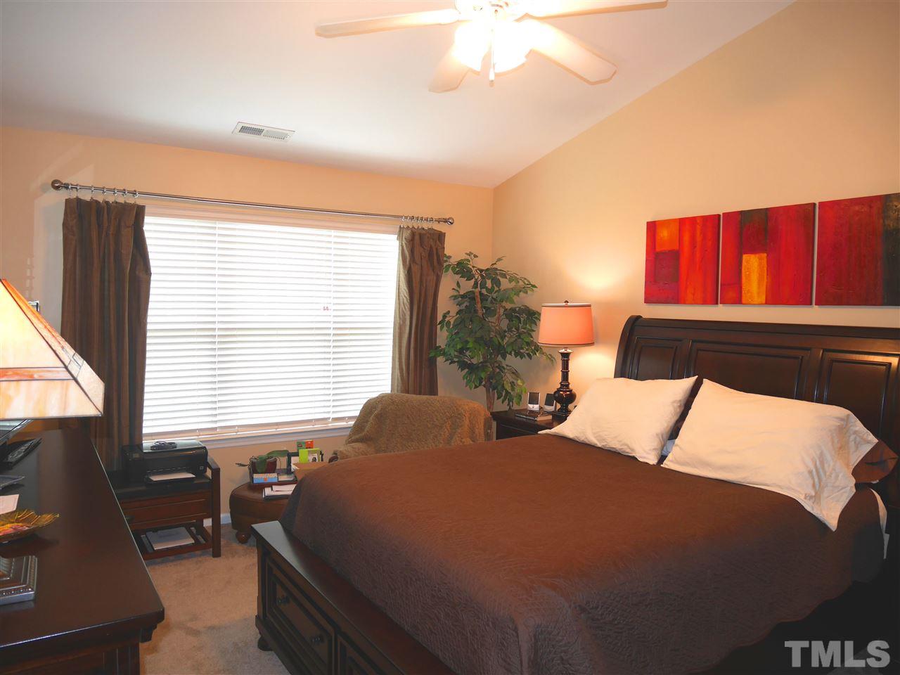 4827 Black Mountain Path Raleigh, NC 27612 - Photo 12 of 19 a bedroom with a bed and window