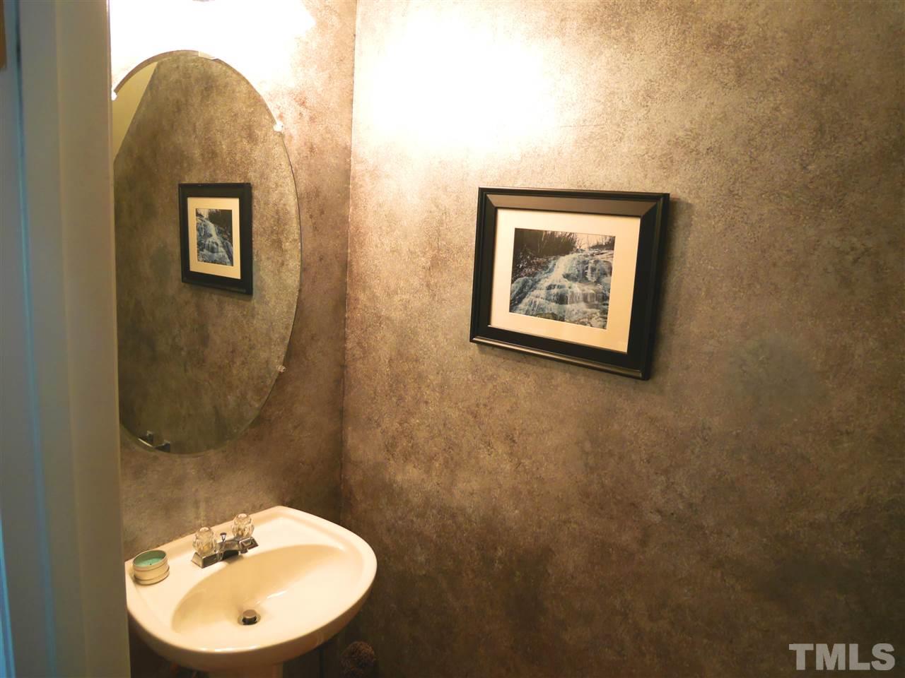 4827 Black Mountain Path Raleigh, NC 27612 - Photo 17 of 19 a bathroom with a toilet and a sink