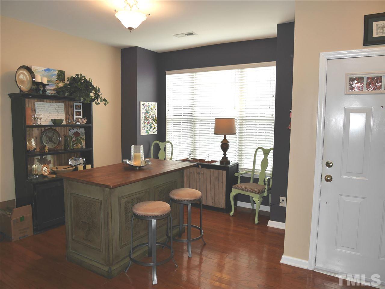 4827 Black Mountain Path Raleigh, NC 27612 - Photo 6 of 19 a view of a dining room with furniture window and outside view