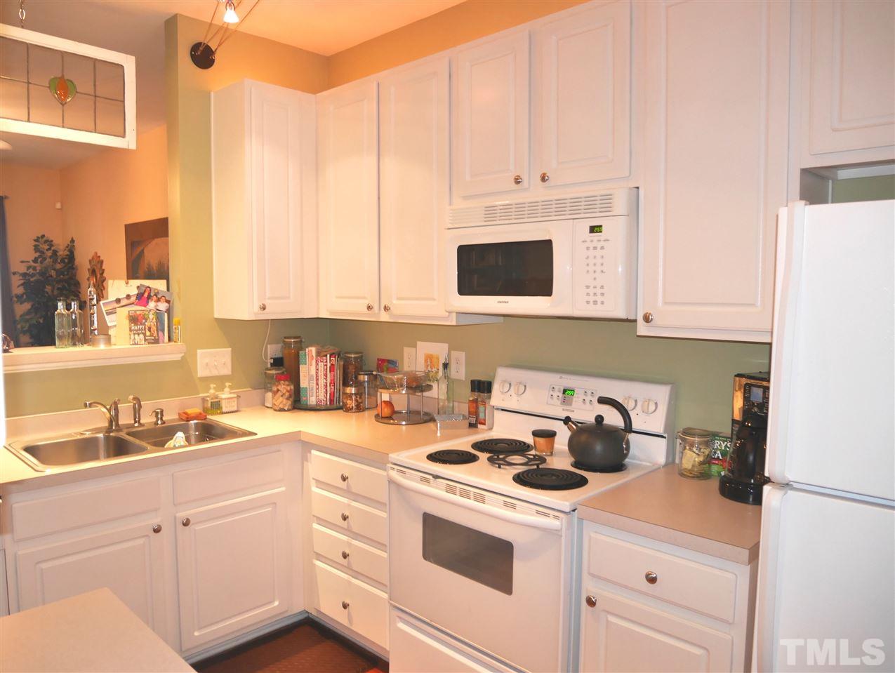 4827 Black Mountain Path Raleigh, NC 27612 - Photo 8 of 19 a kitchen with appliances a sink and cabinets