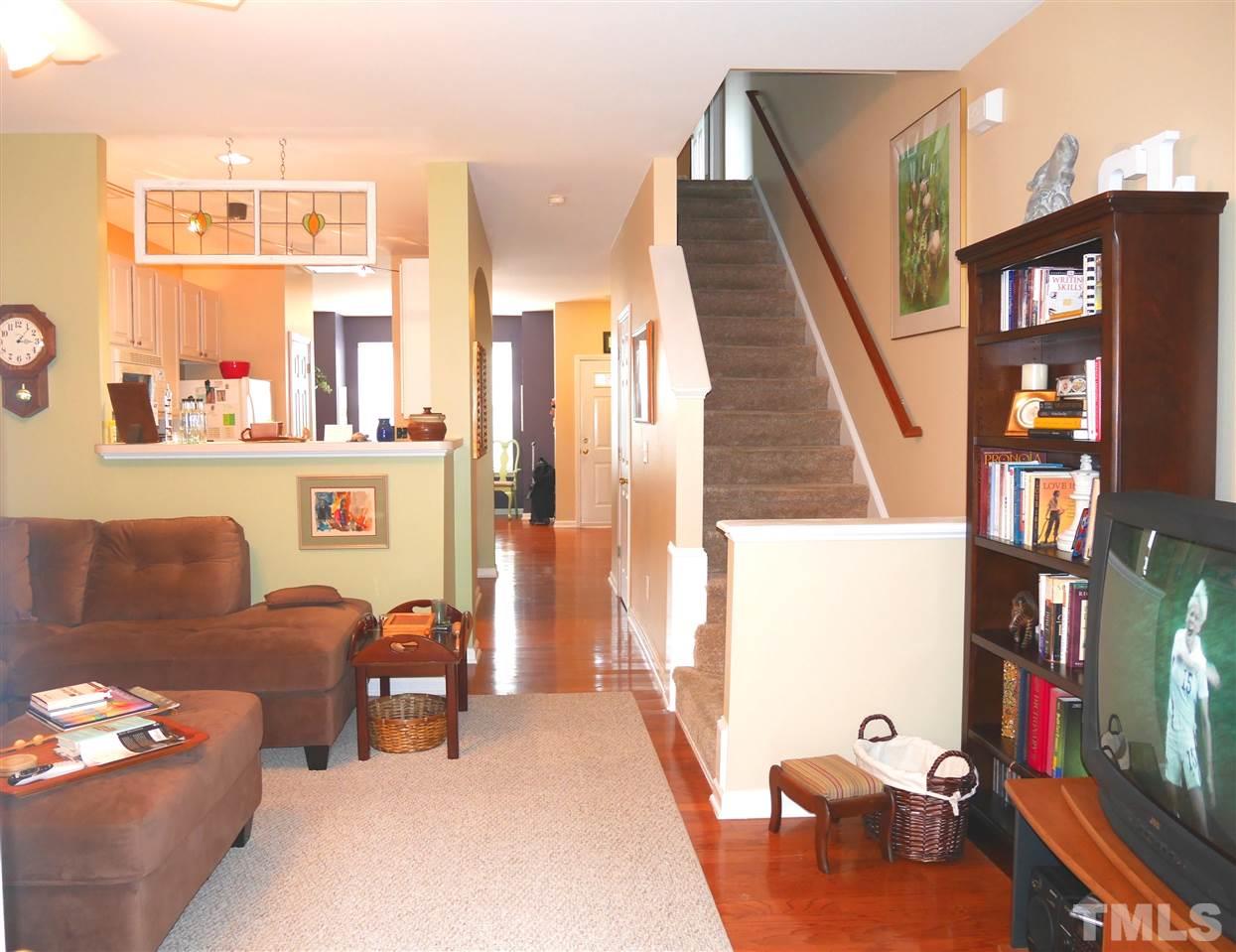 4827 Black Mountain Path Raleigh, NC 27612 - Photo 10 of 19 a living room with furniture a flat screen tv and a couch