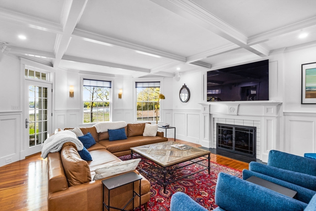 1 R Bailey's Island Road Scituate, MA 02066 - Photo 6 of 42 a living room with furniture fireplace and flat screen tv