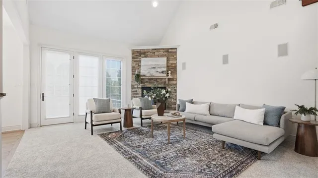 a living room with furniture and a rug