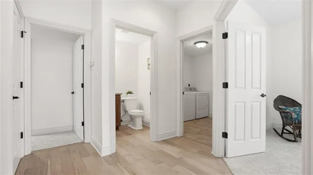 a view of a bathroom with a shower and a sink