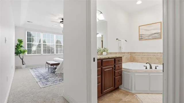 a bathroom with a sink toilet and tub