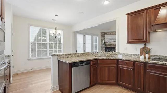 a kitchen with a sink stove and cabinets