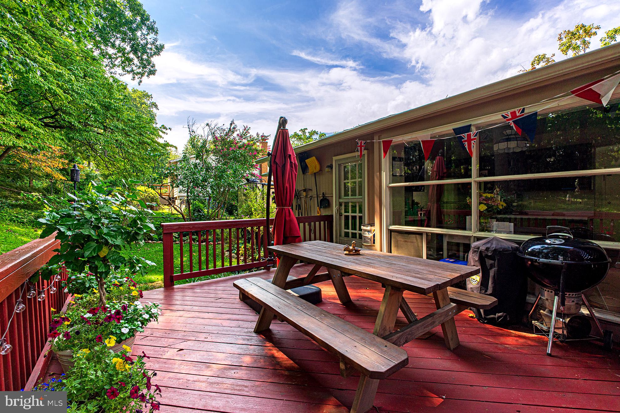 8207 Old Oaks Drive Springfield, VA 22152 - Photo 15 of 19 a view of balcony with wooden floor and outdoor seating