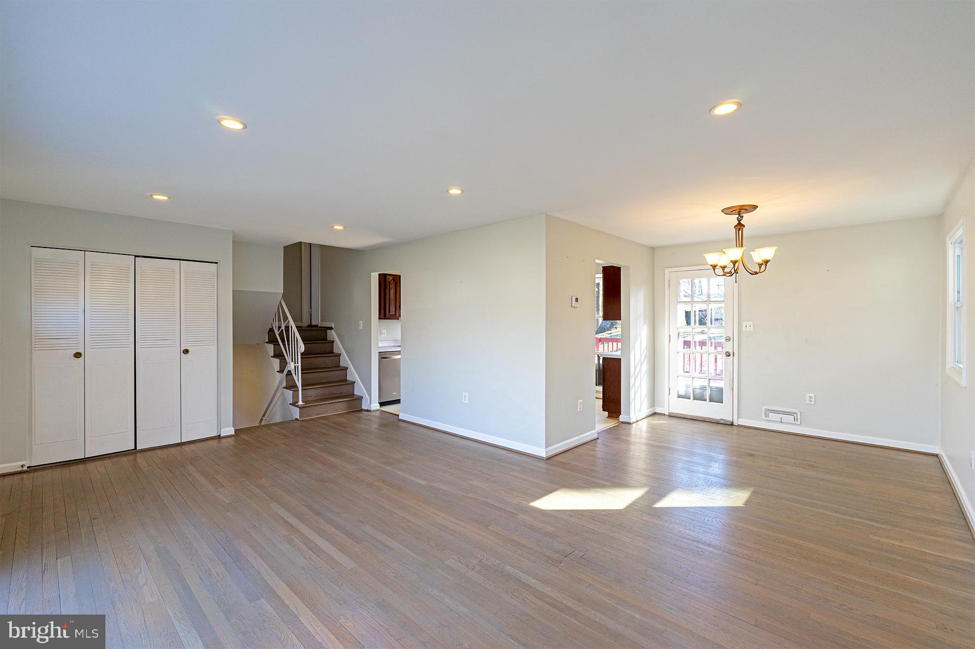 8207 Old Oaks Drive Springfield, VA 22152 - Photo 6 of 19 a view of an empty room with wooden floor