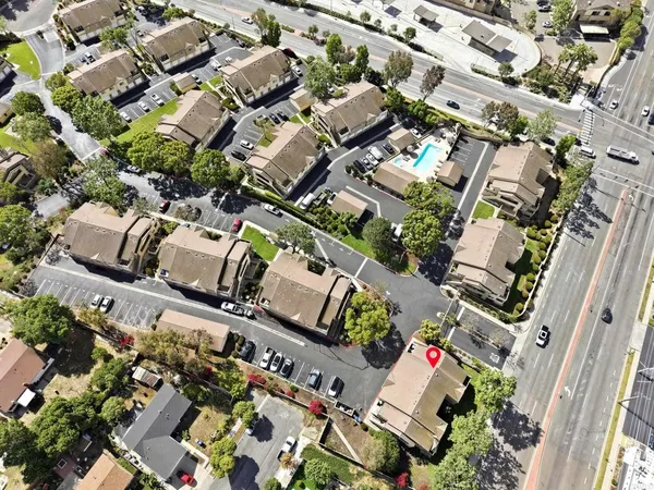an aerial view of residential houses with outdoor space