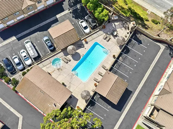 an aerial view of a house with a swimming pool