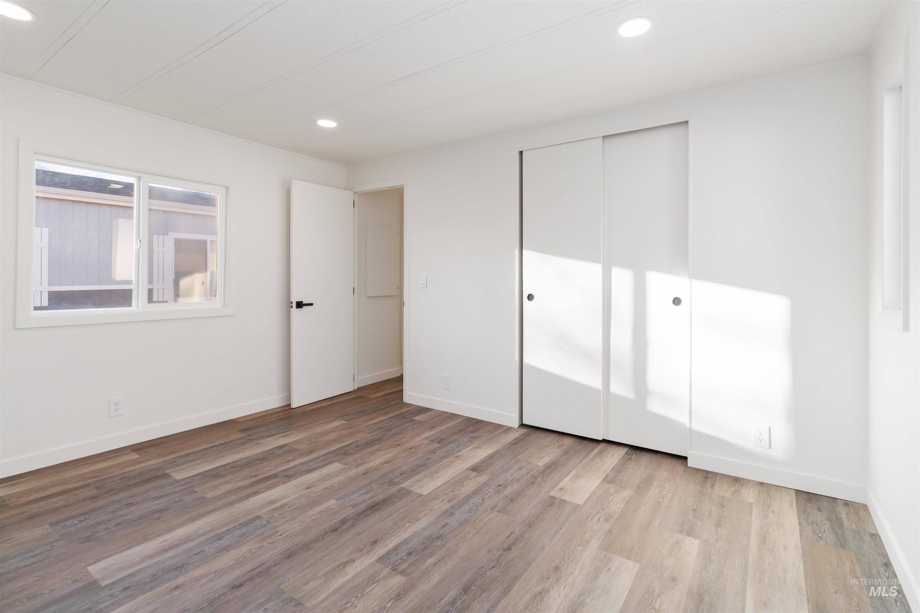 618 Empress Street Boise, ID 83713 - Photo 19 of 27 Unfurnished bedroom featuring light wood-style floors, a closet, and recessed lighting