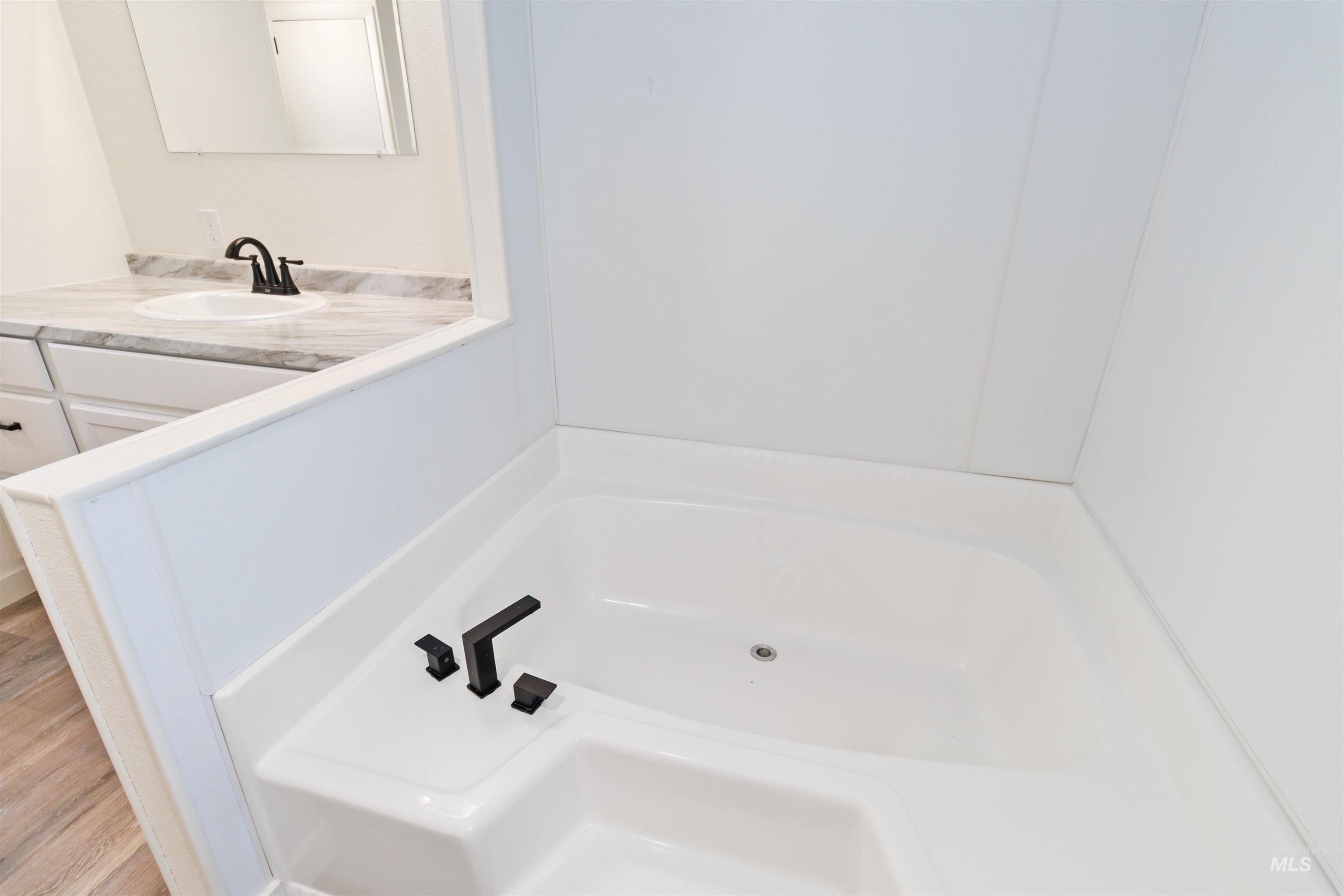 618 Empress Street Boise, ID 83713 - Photo 21 of 27 Full bathroom with a garden tub and vanity