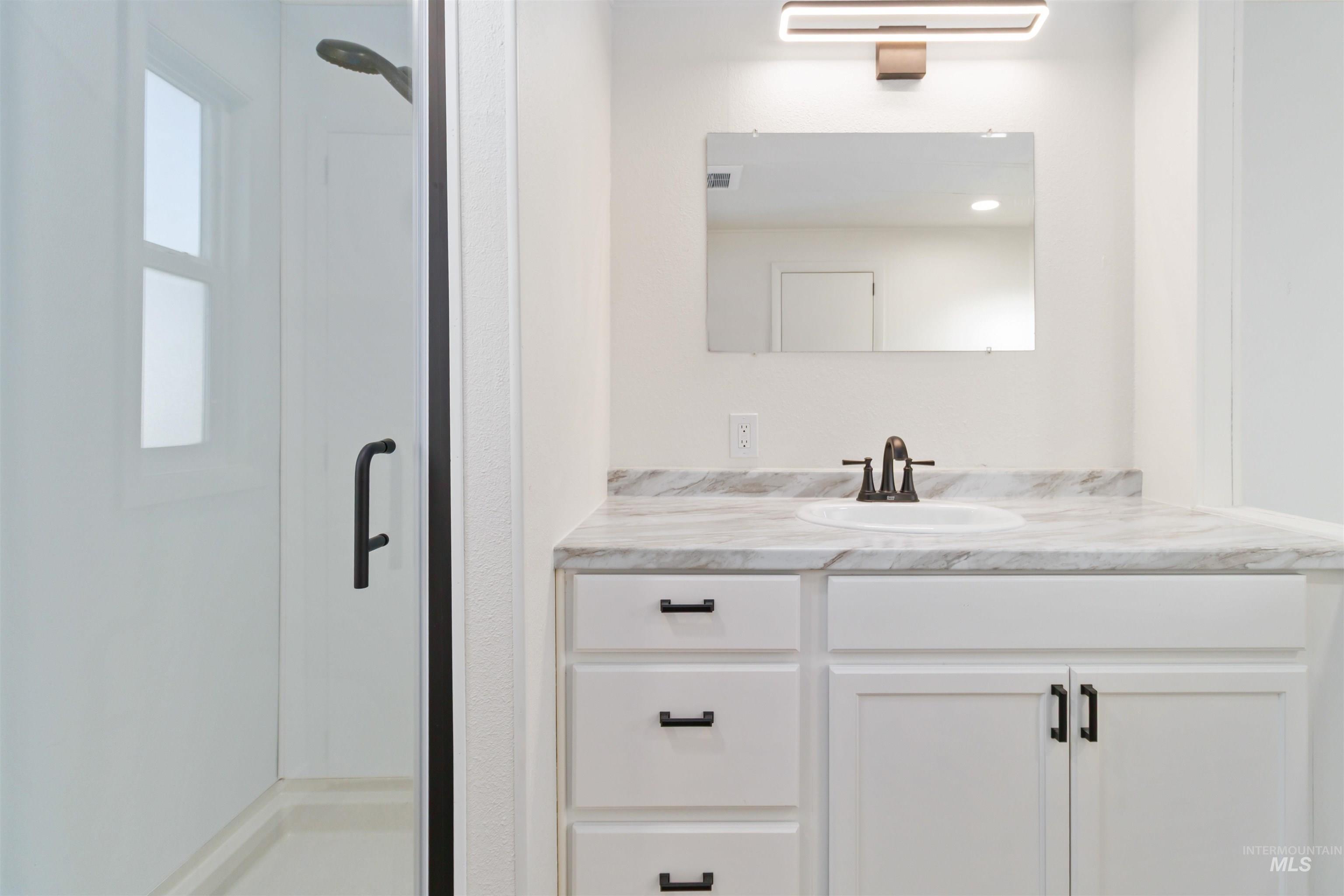618 Empress Street Boise, ID 83713 - Photo 23 of 27 Full bath with a shower stall and vanity
