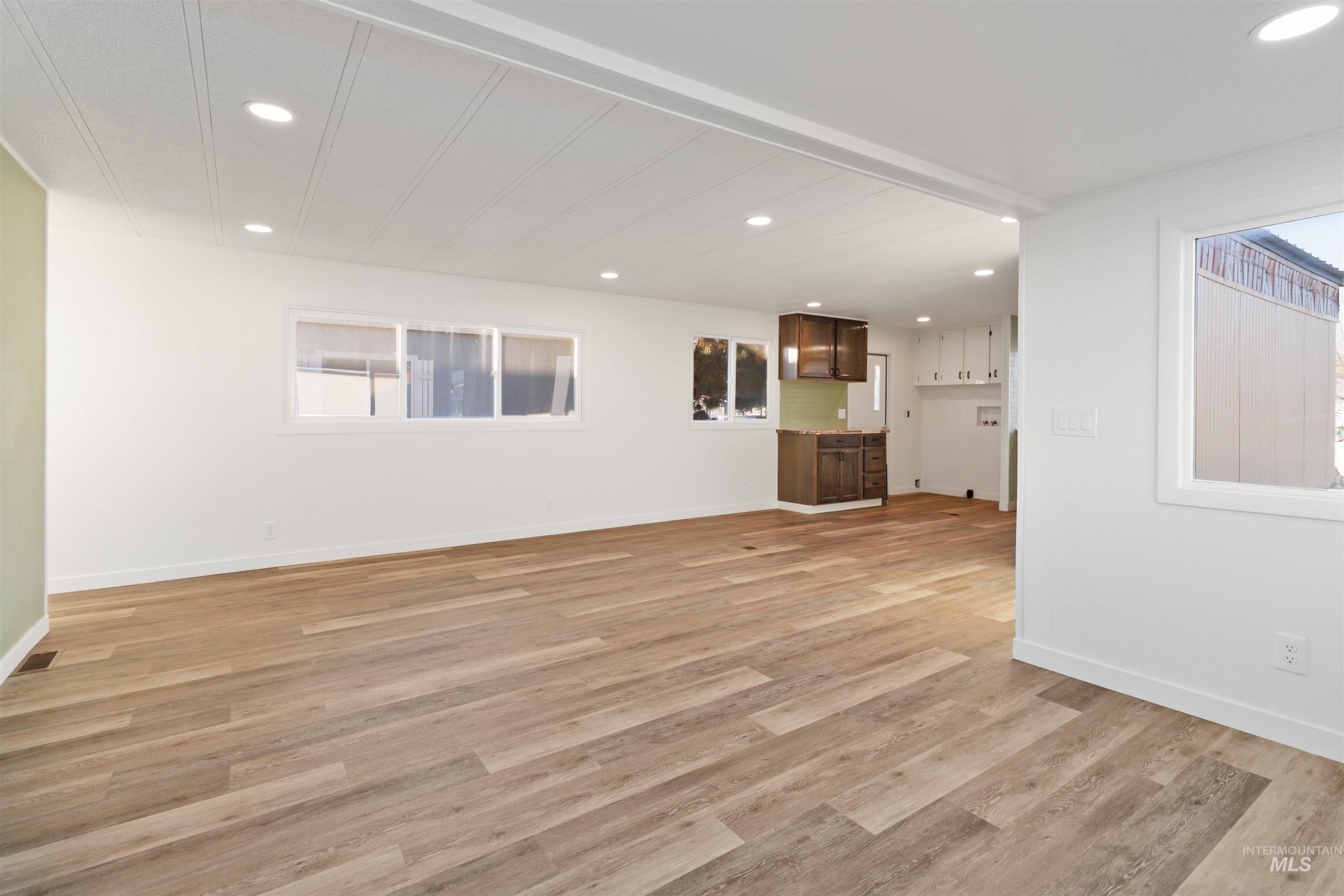 618 Empress Street Boise, ID 83713 - Photo 8 of 27 Unfurnished living room with recessed lighting and light wood-style floors