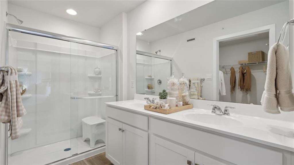 160 River Rdg Drive Moon Township, PA 15108 - Photo 11 of 17 a bathroom with a shower sink vanity and mirror