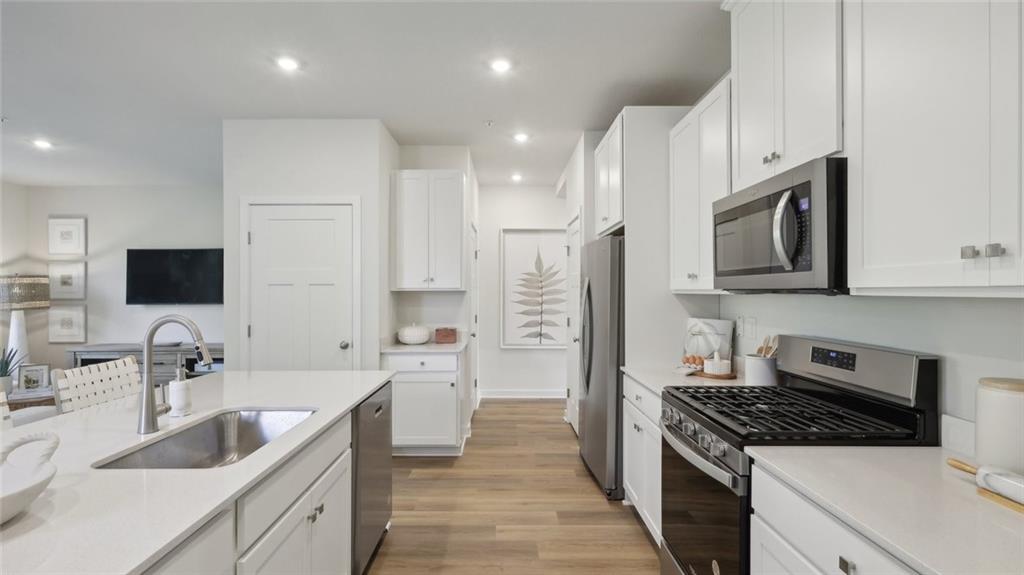 160 River Rdg Drive Moon Township, PA 15108 - Photo 8 of 17 a kitchen with stainless steel appliances granite countertop a sink stove and refrigerator