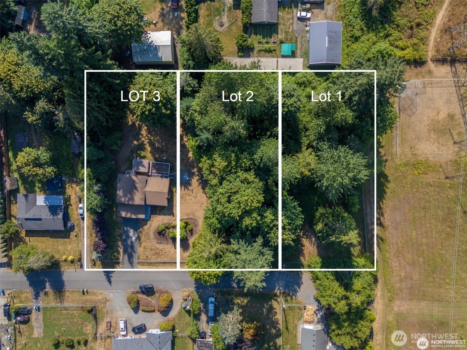 16621 188th Avenue Southeast, Unit 1&2 Renton, WA 98058 - Photo 2 of 5 a balcony with lots of green trees