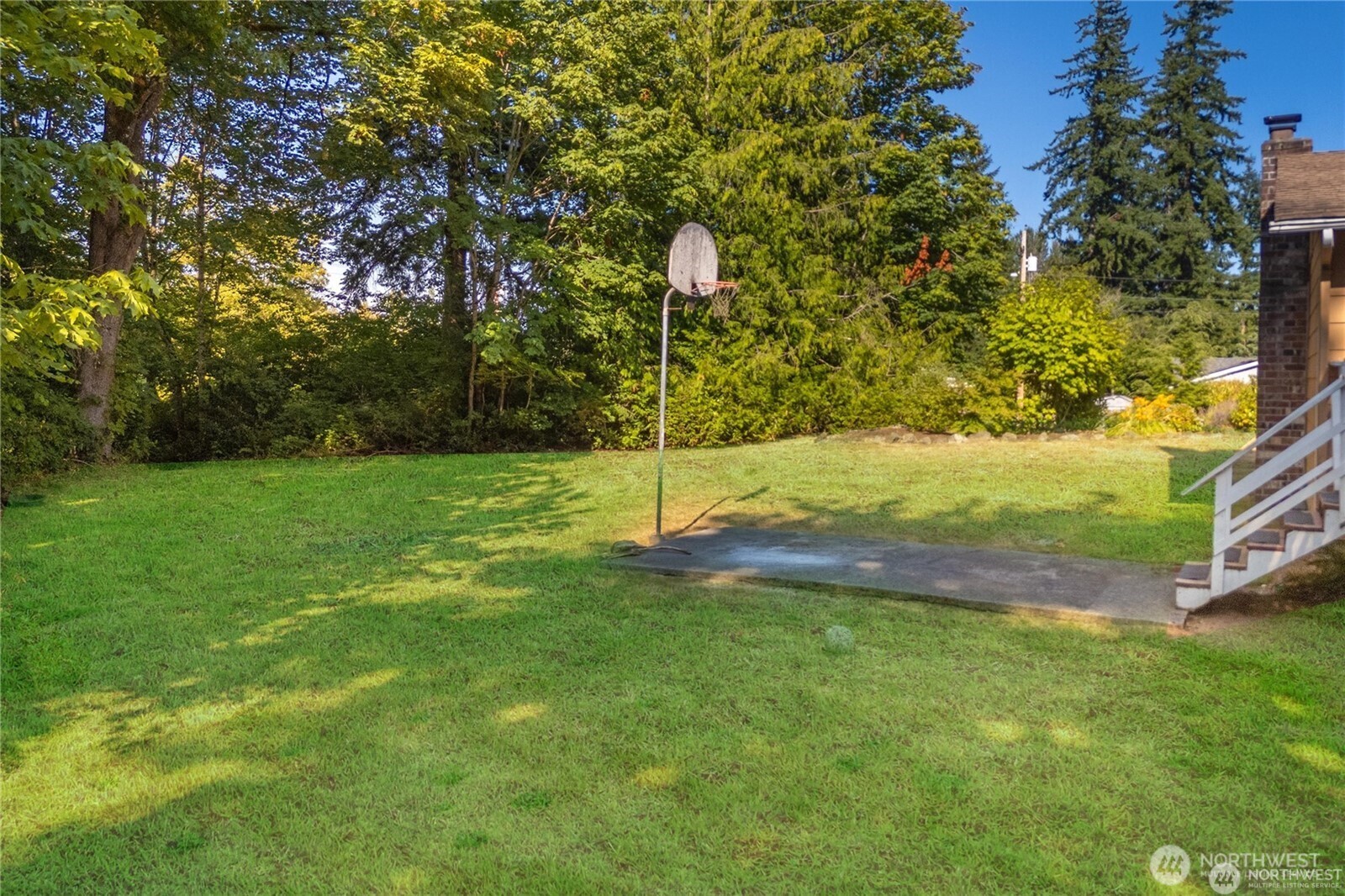16621 188th Avenue Southeast, Unit 1&2 Renton, WA 98058 - Photo 5 of 5 a view of a yard with a tree