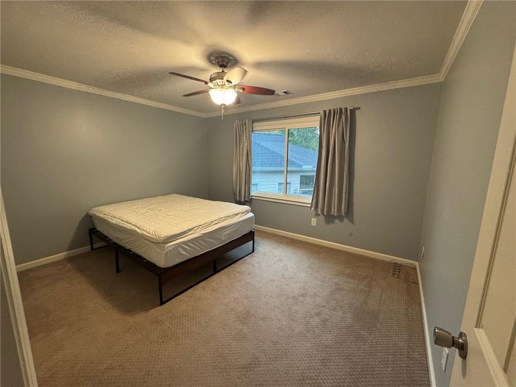 315 Landing Entry Alpharetta, GA 30022 - Photo 14 of 17 an empty room with windows and fan