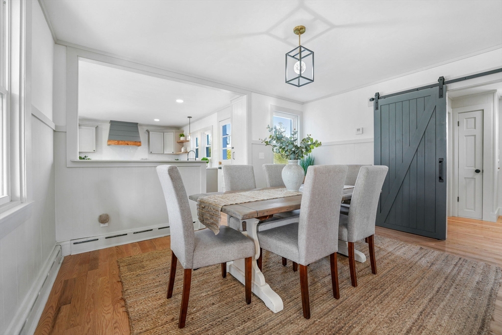 32 Cedar Street Fairhaven, MA 02719 - Photo 11 of 28 a view of a dining room with furniture window and wooden floor