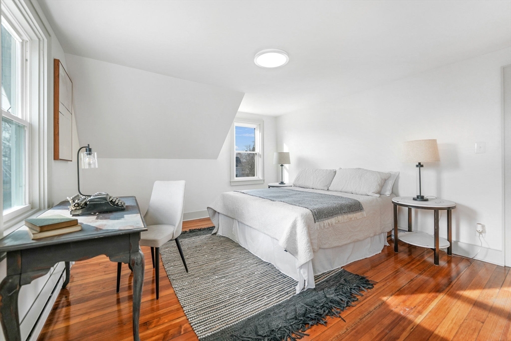 32 Cedar Street Fairhaven, MA 02719 - Photo 13 of 28 a bedroom with a bed and wooden floor