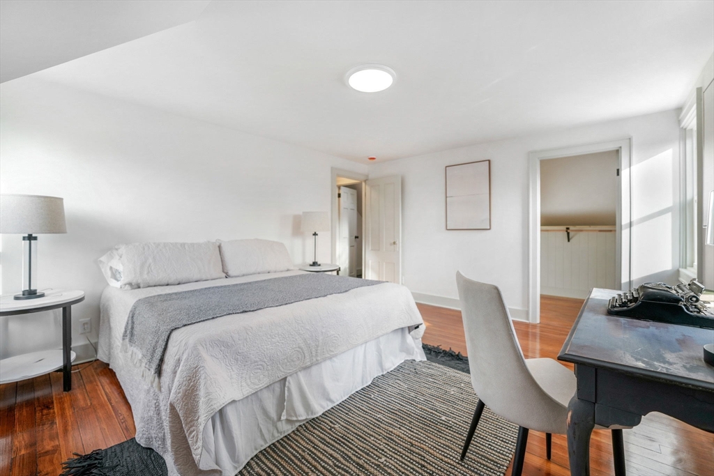32 Cedar Street Fairhaven, MA 02719 - Photo 14 of 28 a bedroom with a bed and a desk