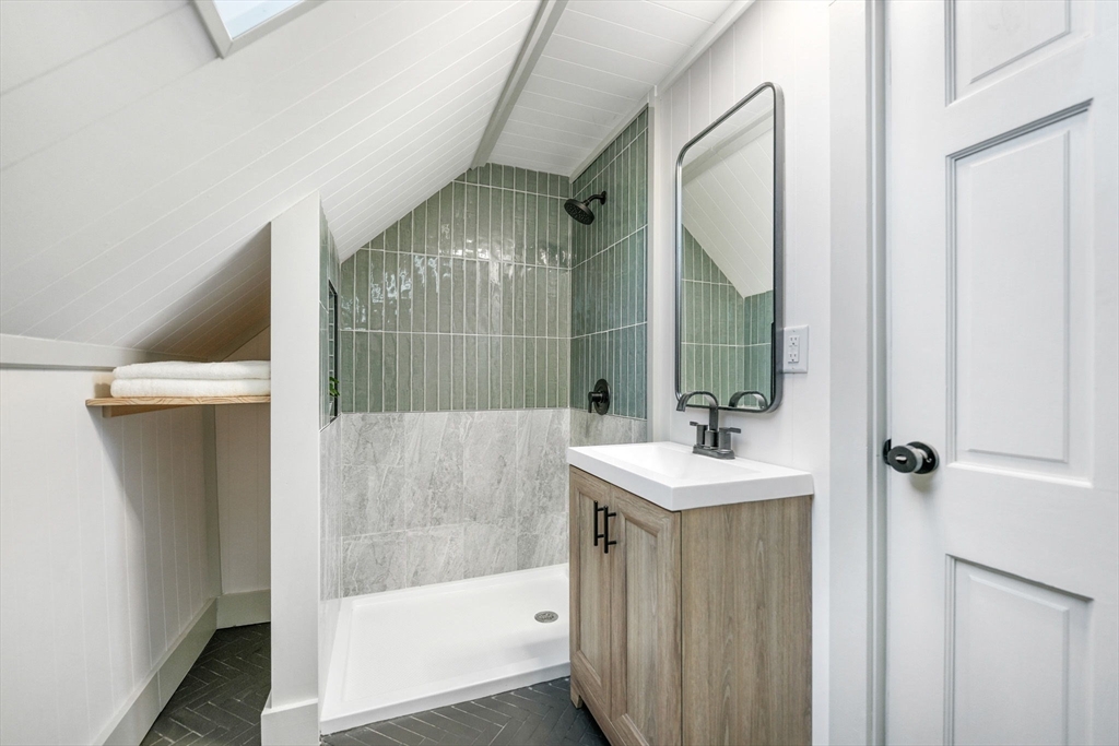 32 Cedar Street Fairhaven, MA 02719 - Photo 15 of 28 a bathroom with a sink a toilet and shower
