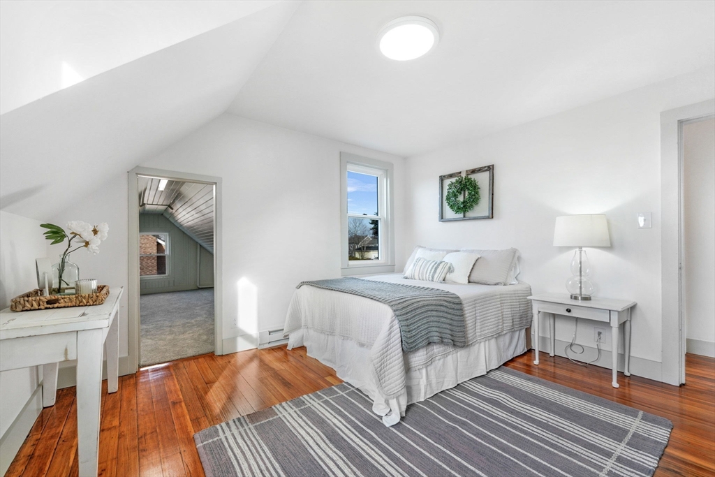 32 Cedar Street Fairhaven, MA 02719 - Photo 16 of 28 a bedroom with a bed and a table