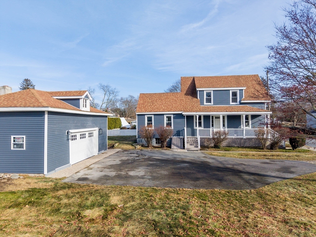 32 Cedar Street Fairhaven, MA 02719 - Photo 2 of 28 a front view of a house with garden