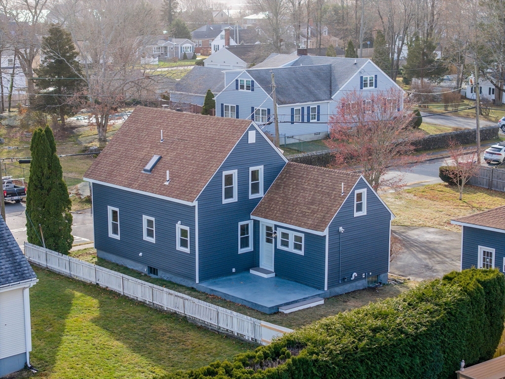 32 Cedar Street Fairhaven, MA 02719 - Photo 23 of 28 a aerial view of a house next to a big yard with plants and large trees