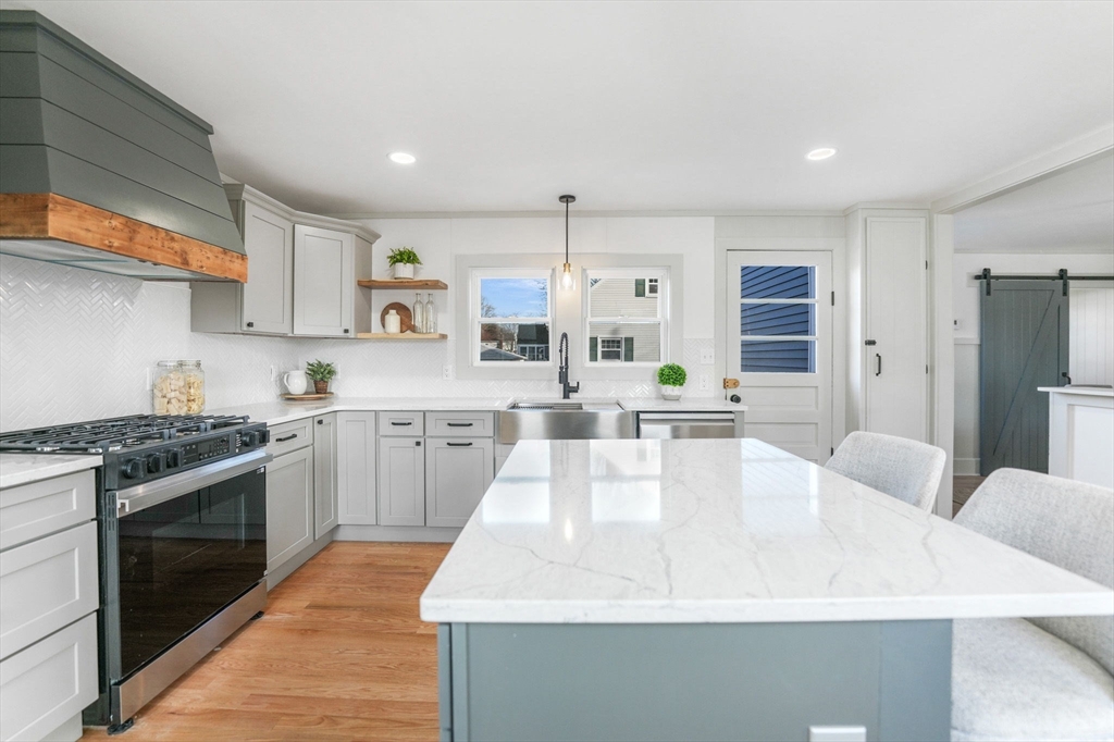 32 Cedar Street Fairhaven, MA 02719 - Photo 3 of 28 a large white kitchen with stainless steel appliances
