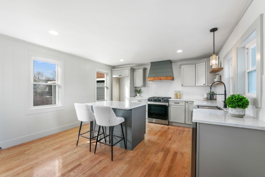 32 Cedar Street Fairhaven, MA 02719 - Photo 5 of 28 a kitchen with a table and chairs in it