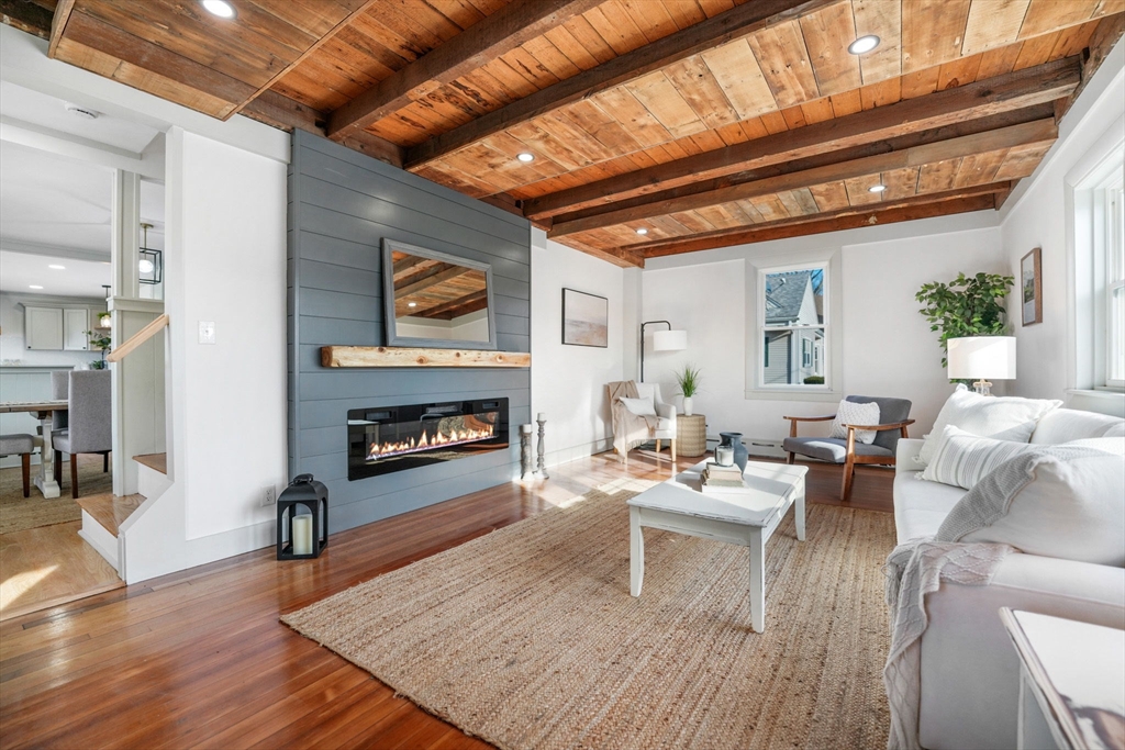 32 Cedar Street Fairhaven, MA 02719 - Photo 8 of 28 a living room with furniture and a fireplace