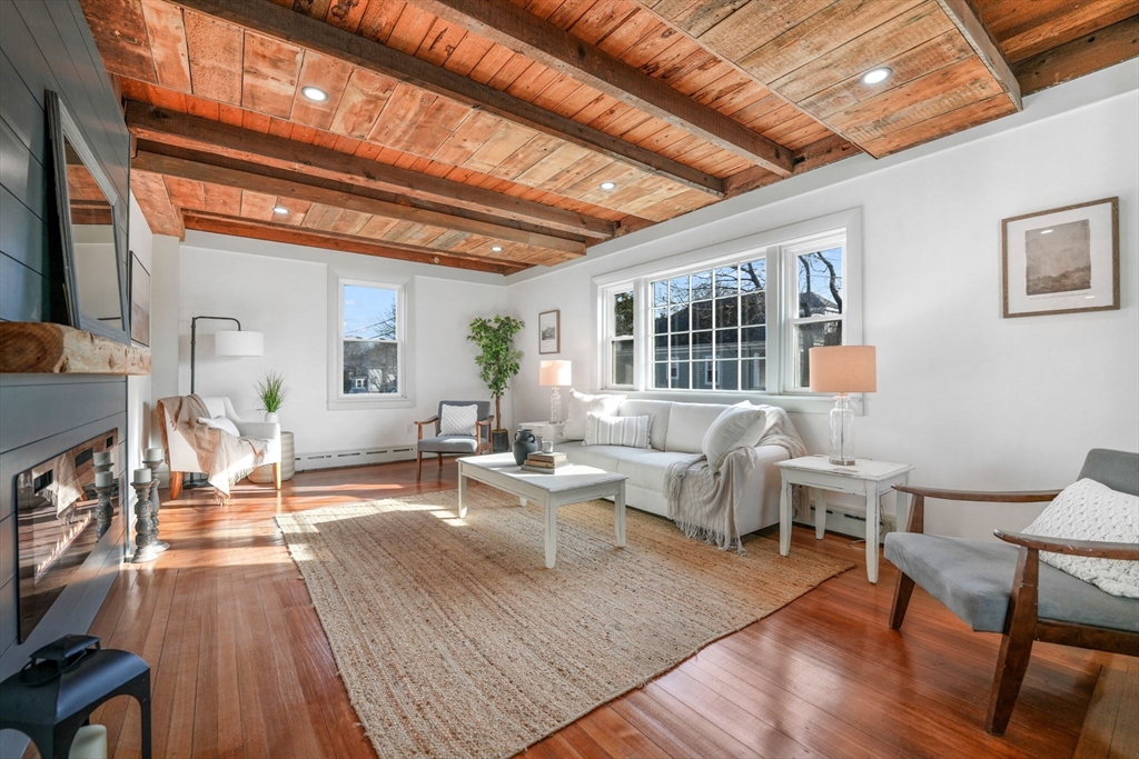 32 Cedar Street Fairhaven, MA 02719 - Photo 9 of 28 a living room with furniture a wooden floor and next to a window